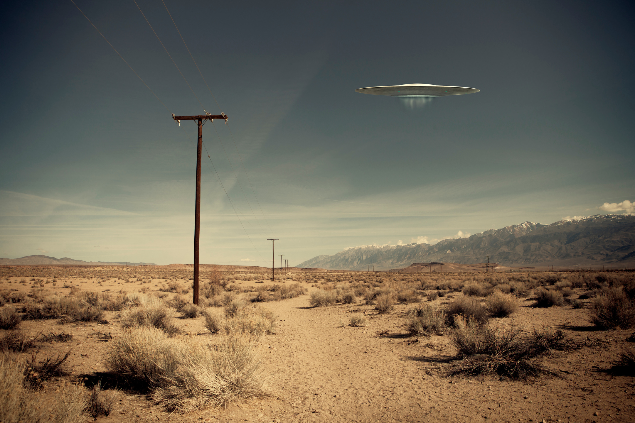 UFO over desert road