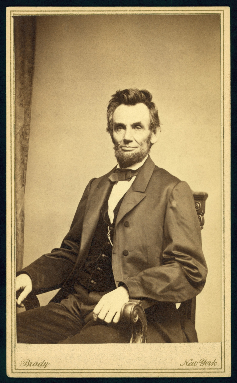 President Abraham Lincoln (1809-1865) seated, taken January 8, 1864 by Mathew Brady (1823-1896).